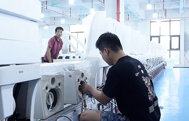 Technician testing smart toilet electronic and safety functions.